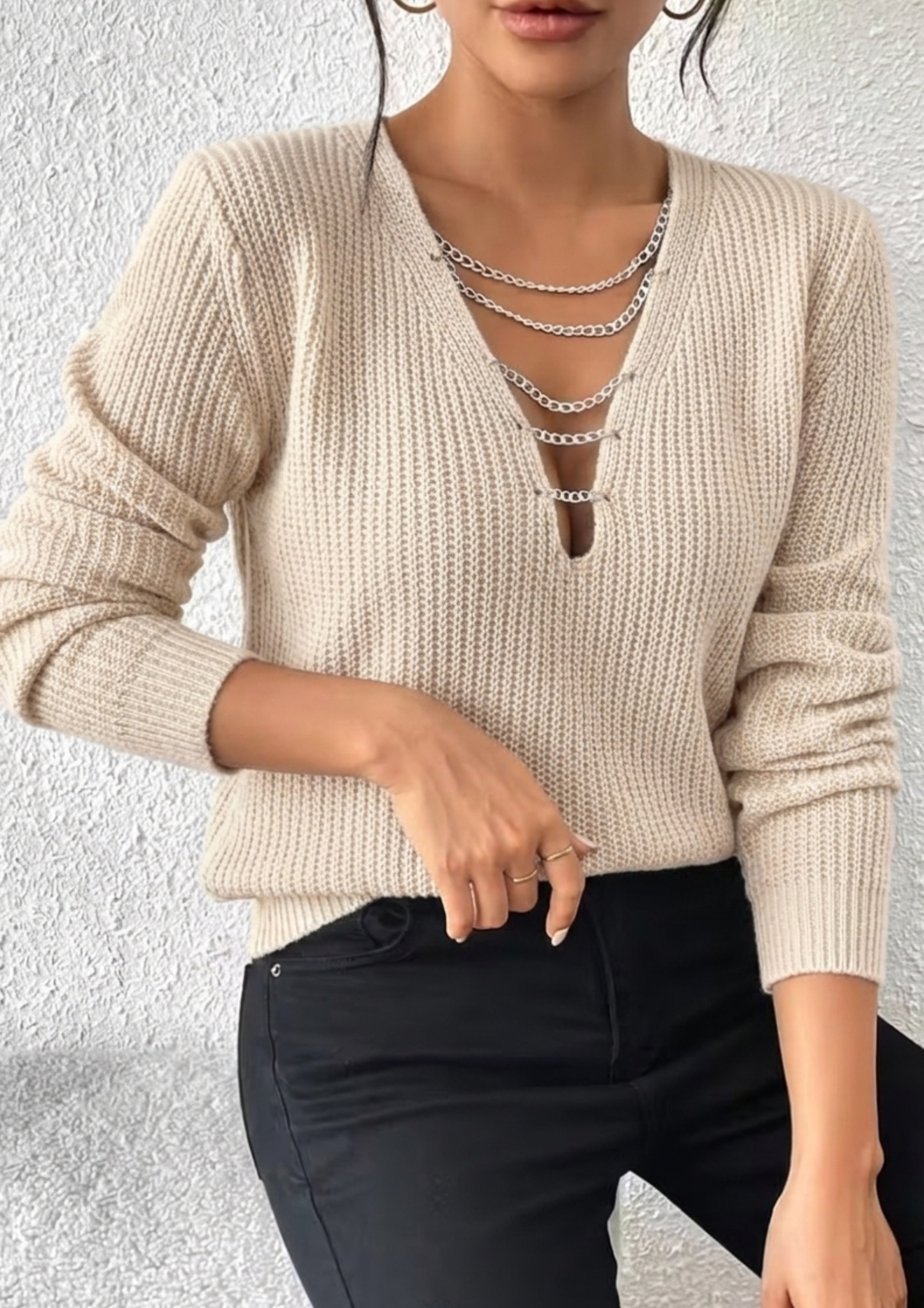 Pull en maille côtelée, avec détail chaîne
