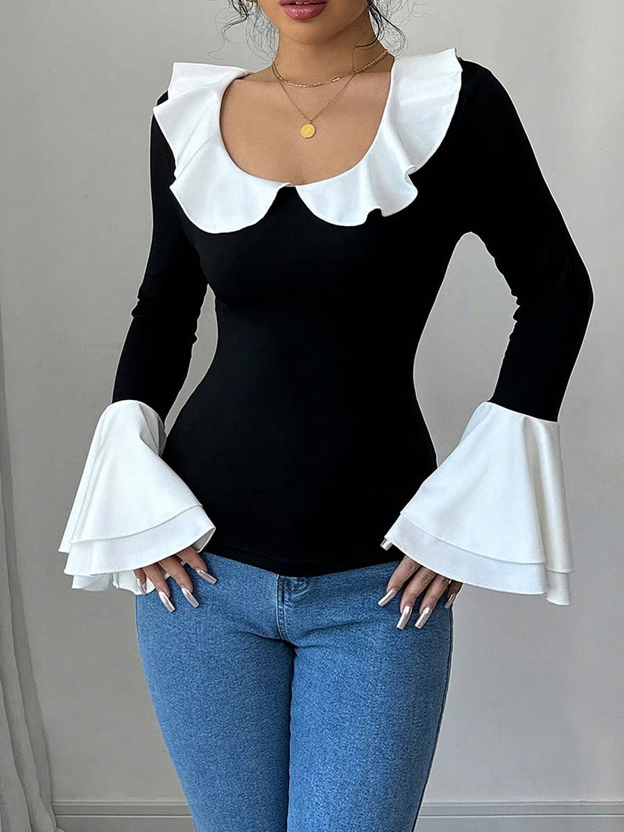Top noir uni à col volanté et bordure contrastée
