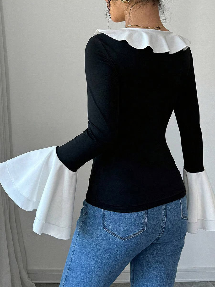 Top noir uni à col volanté et bordure contrastée