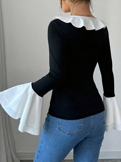 Top noir uni à col volanté et bordure contrastée